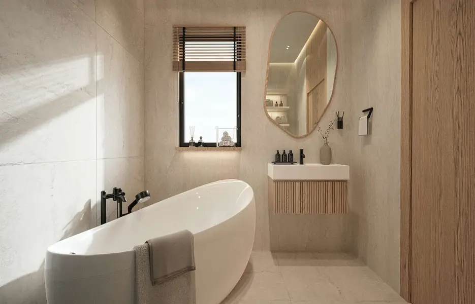 Bathroom with freestanding tub and stone finishes